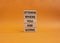 Determination symbol. Wooden blocks with words Determine where you are going. Beautiful orange background. Business and Determine