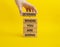 Determination symbol. Wooden blocks with words Determine where you are going. Beautiful yellow background. Businessman hand.