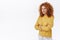 Determined, ambitious good-looking redhead curly woman in yellow sweater, feeling confident cross arms chest, standing