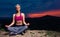 Determined Athletic Fitness Woman Meditating