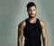 Determined and disciplined. Studio portrait of an athletic young man posing against a gray background.