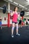 Determined Female Lifting Heavy Barbell