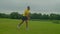 Determined fit African man practicing plyometric jumping lunges outdoors