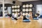 Determined Friends Exercising With Medicine Ball In Gym