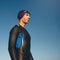 Determined male triathlete in wetsuit