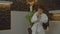 Determined multiracial karate kid in kimono training karate skills indoors