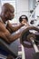 Determined muscular man lifting barbell in gym