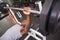 Determined muscular man lifting barbell in gym