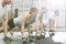 Determined people doing pushups with kettlebells at crossfit gym