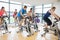 Determined people working out at spinning class