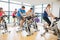 Determined people working out at spinning class