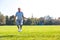 Determined senior man working out with skipping rope in park