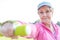 Determined senior woman exercising with dumbbell in park