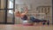 Determined sporty fitness senior woman doing stability ball I Y T shoulder raise