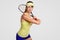Determined sporty healthy female tennis player holds racquet, re