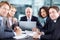 Only the determined succeed in business. Business executives sitting at a table during a meeting and using a laptop -