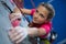 Determined teenage girl practicing rock climbing