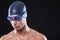 Determined to dominate the swimming lane. Studio portrait of a young male swimmer with goggles and cap.