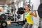 Determined woman lifting a barbell