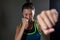 Determined woman practicing boxing in fitness studio