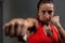 Determined woman practicing boxing in fitness studio