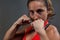 Determined woman practicing boxing in fitness studio