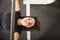 Determined Woman Pumping Muscles With Barbell On Bench Press