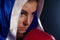 Determined woman wearing boxing robe