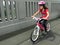 Determined young girl rides a bike