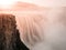 Detifoss waterfall illuminated by sunset, northern Iceland. Silk water effect by long exposure time