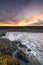 Detifoss waterfall with sunset in the background