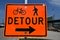 Detour sign instructs bikers and walkers