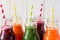 Detox drinks in bottles: fresh smoothies from vegetables: beet, carrot, spinach, cucumber and apple