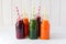 Detox drinks in bottles: fresh smoothies from vegetables: beetroot, carrot, spinach, cucumber and apple