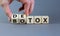 Detox vs botox. Hand turns cubes and changes the word `botox` to `detox` or vice versa. Beautiful grey background. Medical and