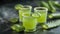 Detoxifying Aloe Vera Juice in Small Glasses on a blurry Background