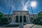 Detroit Institute of Arts with the statue of The Thinker in front of it under a blue sky