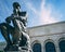 Detroit Institute of Arts under a cloudy sky with the statue of The Thinker in front of it