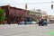 DETROIT, MICHIGAN, UNITED STATES - MAY 22, 2018: street with traffic lights, cars and low houses with stores in a suburb