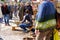 Dettingen, Germany, October 2021: creative woman weave beautiful basket from willow twigs, people works in market square, true