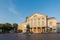 Deutsches Nationaltheater und Staatskapelle Weimar am Theaterplatz am Morgen bei Sonne und blauem Himmel