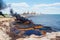 Devastating oil spill marine life in peril, fishing boats amidst toxic slick, beaches contaminated