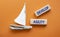 Develop agility symbol. Concept word Develop agility on wooden blocks. Beautiful orange background with boat. Business and Develop