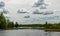 A developed bog lake, swampy meadows and bogs wonderful cumulus clouds and reflections in the water, Sedas heath, Latvia