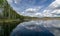 A developed bog lake, swampy meadows and bogs wonderful cumulus clouds and reflections in the water, Sedas heath, Latvia