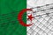 Developing Algeria Flag, mesh fence and barbed wire. Concept of isolation of emigrants. With place for your text