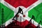 Developing Flag of Burundi. Silhouette of drilling rigs and oil rigs on a flag background. Oil and gas industry. The concept of