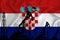 Developing Flag of Croatia. Silhouette of drilling rigs and oil rigs on a flag background. Oil and gas industry. The concept of