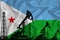 Developing Flag of Djibouti. Silhouette of drilling rigs and oil rigs on a flag background. Oil and gas industry. The concept of