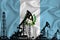 Developing Flag of Guatemala. Silhouette of drilling rigs and oil rigs on a flag background. Oil and gas industry. The concept of